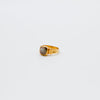 Gold ring with a gemstone on a white background